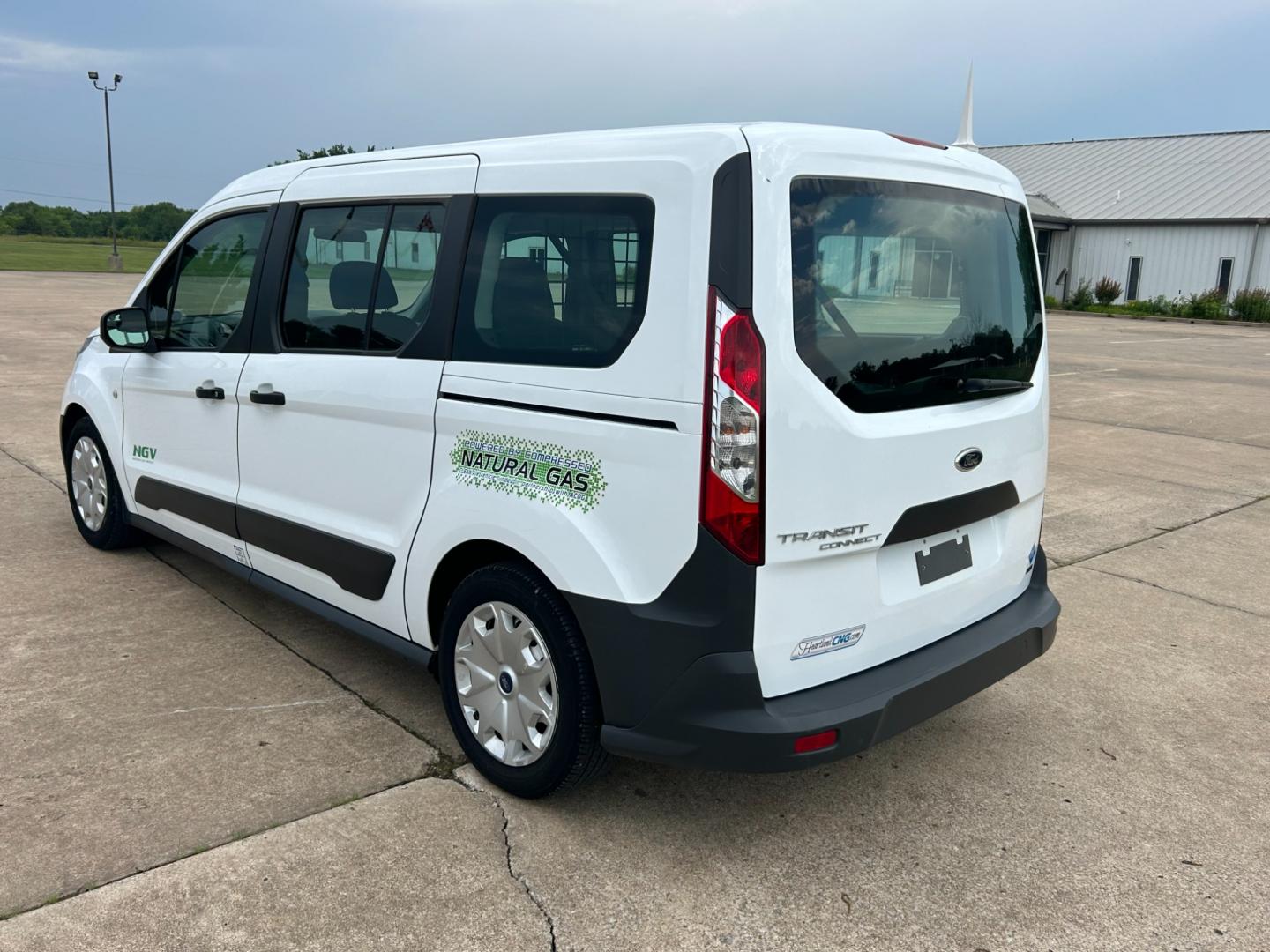 2014 White /Gray Ford Transit Connect Wagon XL w/Rear Liftgate LWB (NM0GE9E75E1) with an 2.5L L4 DOHC 16V engine, 6-Speed Automatic transmission, located at 17760 Hwy 62, Morris, OK, 74445, (918) 733-4887, 35.609104, -95.877060 - 2014 FORD TRANSIT CONNECT HAS 2.5L ENGINE, FEATURES POWER LOCKS, POWER WINDOWS, POWER MIRRORS, AM/FM STEREO, CRUISE CONTROL, BLUETOOTH HANDS-FREE CALLING, BACKSEAT,IT RUNS ON CNG (COMPRESSED NATURAL GAS) OR GASOLINE. A PREMIER ALTERNATIVE FUEL CONVERSION THAT IS EPA-APPROVED. EXTREMELY CLEAN-BURNING - Photo#6